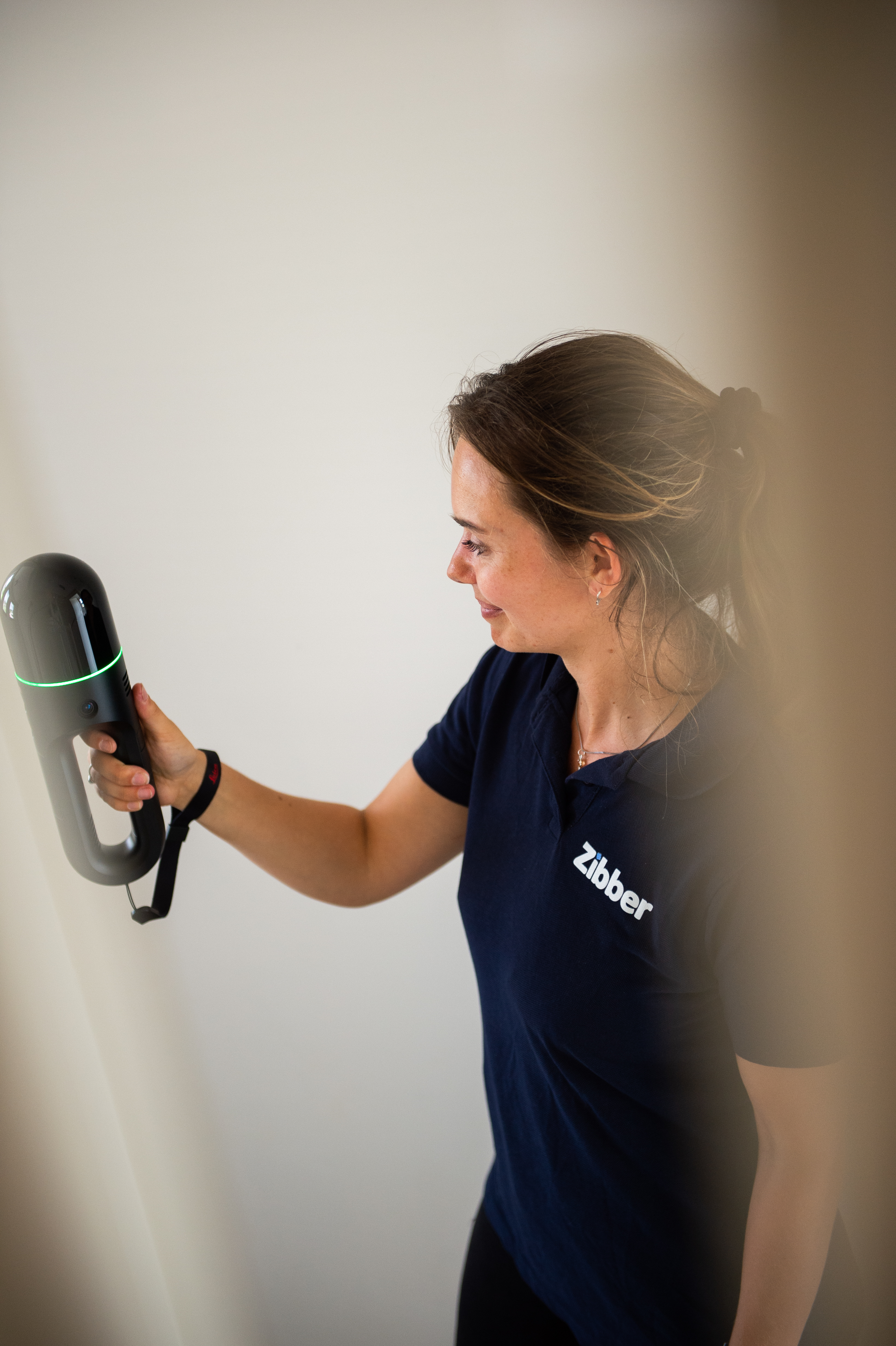 Woman scanning a space with a BLK2GO