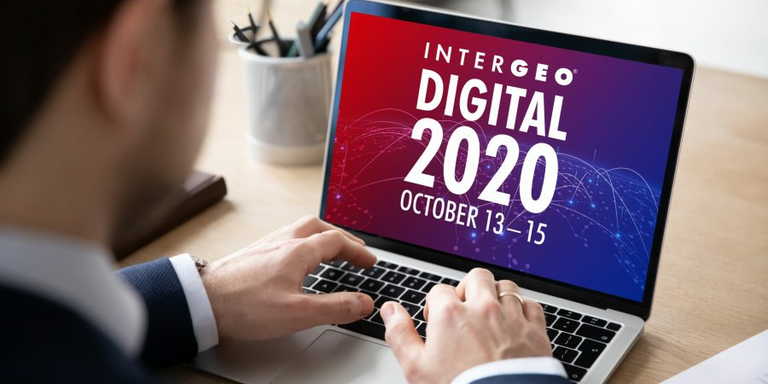 Man in a suit viewing Intergeo Digital 2020 on a laptop