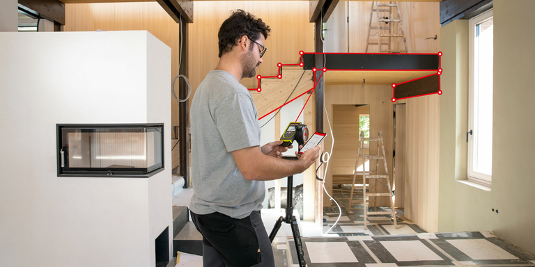 A man measures stairs with a Leica DISTO X6 laser measure on a Leica DST 360-X tripod adapter and transfers the results to the DISTO Plan app on his smartphone