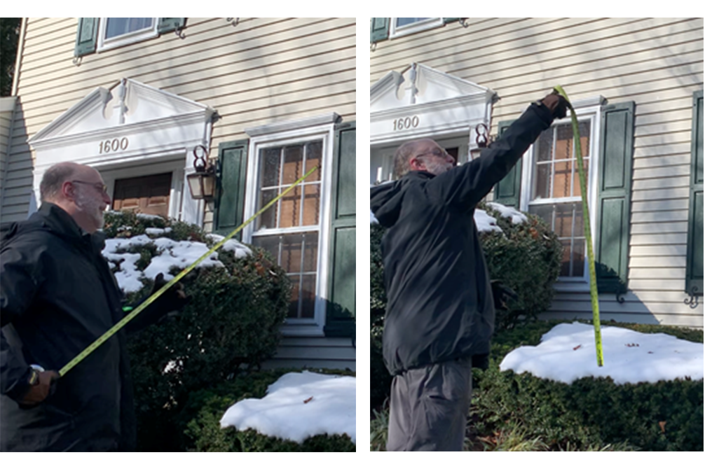 Architect Scott Siegel using a measuring tape