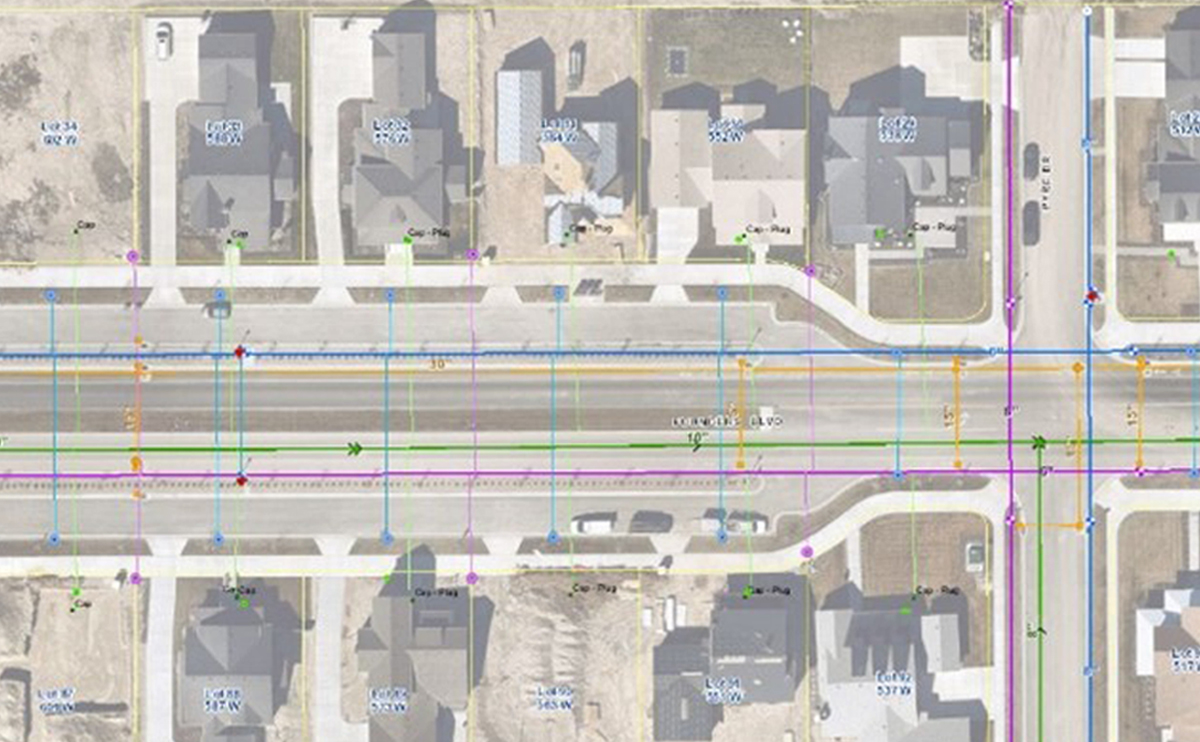 Overhead view of a neighborhood and outline display of infrastructure below ground-level